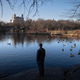 A visitor stands in Central Park on January 30, 2023.